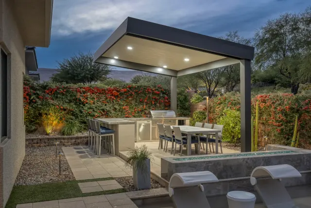 Pool-adjacent patio and shade structure in a Las Vegas backyard renovation